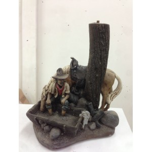 COWBOY AND HORSE SCULPTURE